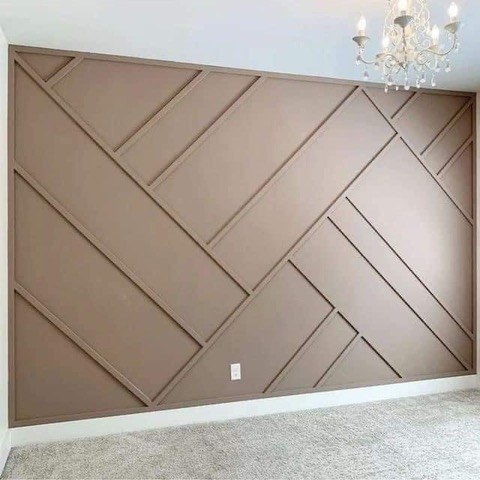 Brown batten board accent wall with custom carpentry trim by Jeff Handyman