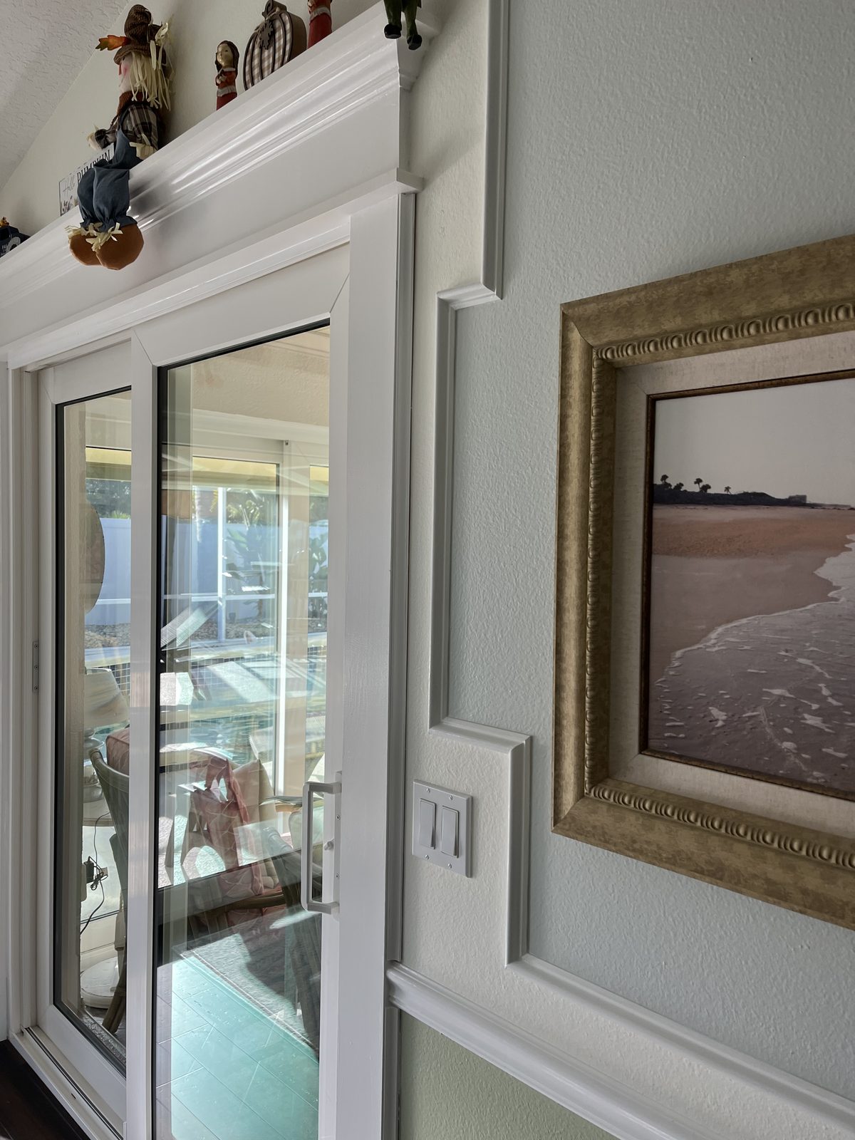 Interior glass double doors with dark frames and matching sidelights