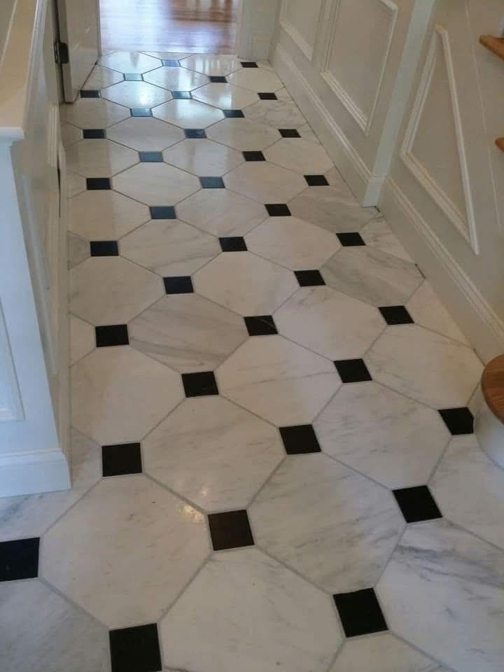 Marble octagonal tile floor with black diamond accent dots in a Florida bathroom by Jeff Handyman