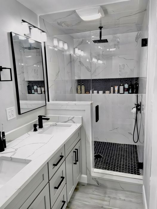 Bathroom with black penny tile floor and custom trim