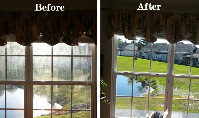 Window cleaning before and after: hazy stained glass restored to clear lake view