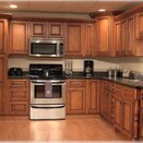 kitchen_remodel__lamate_floor__and_custom_wood_cabinest.jpg